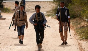 Fighters from Misrata move towards positions of Islamic State militants near Sirte, Libya, March 15, 2015. (photo by REUTERS/Goran Tomasevic)