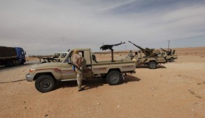 Libyan military vehicles are pictured at a checkpoint in Wadi Bey, west of the Islamic State-held city of Sirte, Feb. 23, 2016. (photo by REUTERS/Ismail Zitouny)